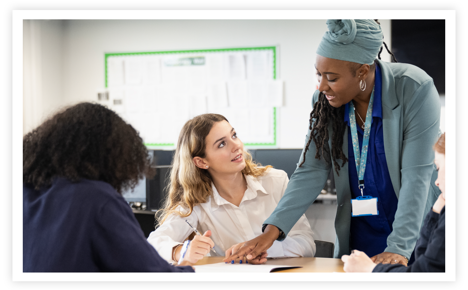 Photo of a teacher working with a student