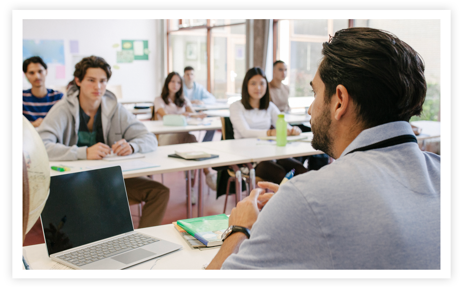 stock image of teacher in front of class of students