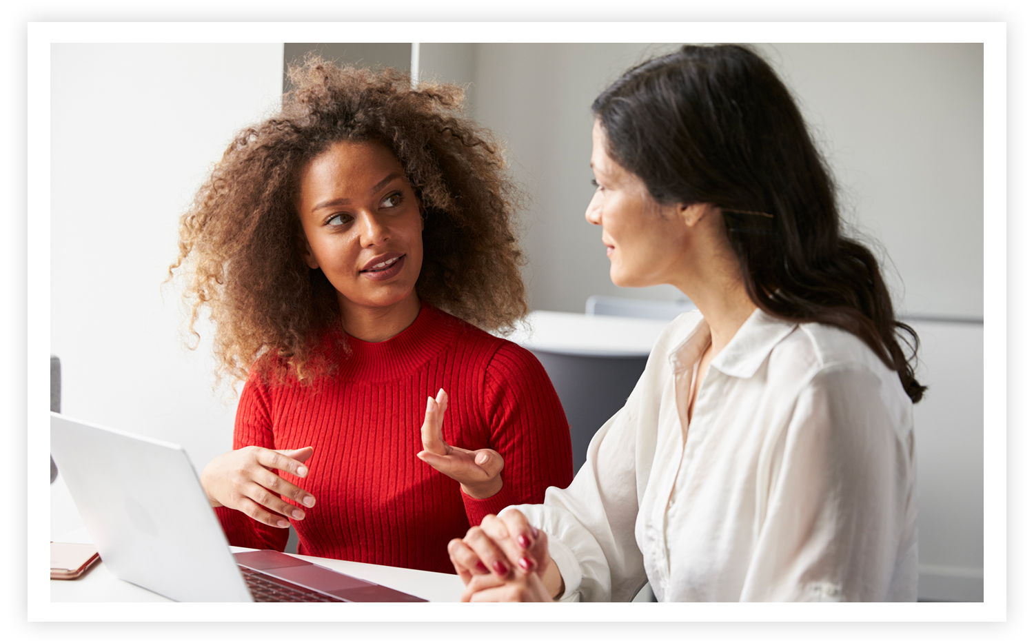 Two women discussing professional development